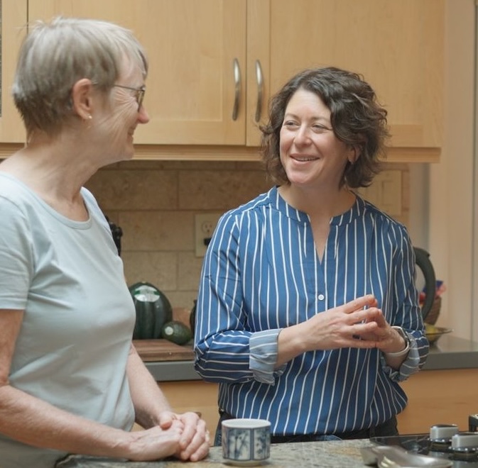 Emily talks to a voter at her home.